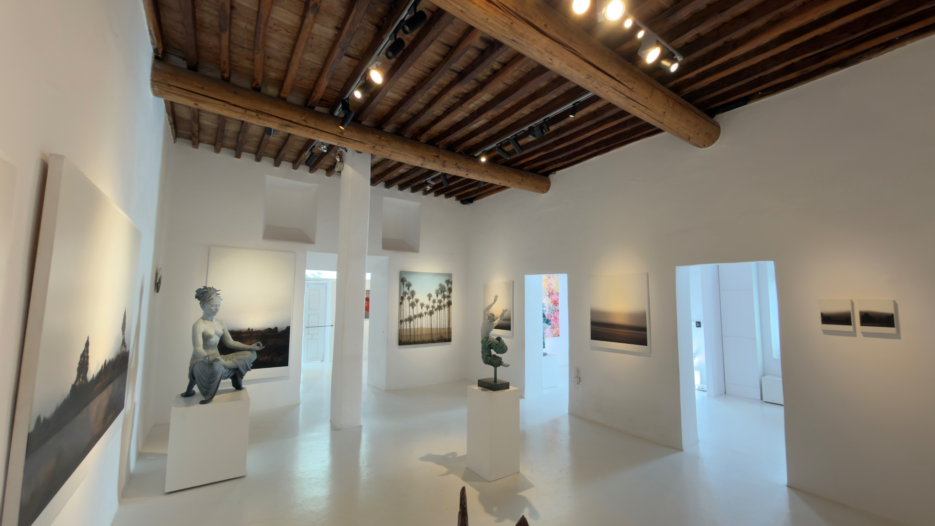 Minima Gallery interior with paintings and bronze sculptures